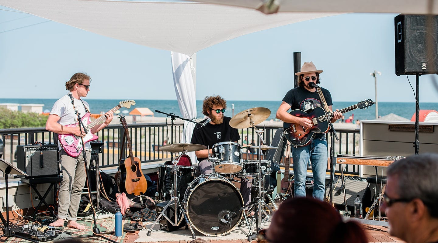 Band playing live music on Harry's rooftop bar.